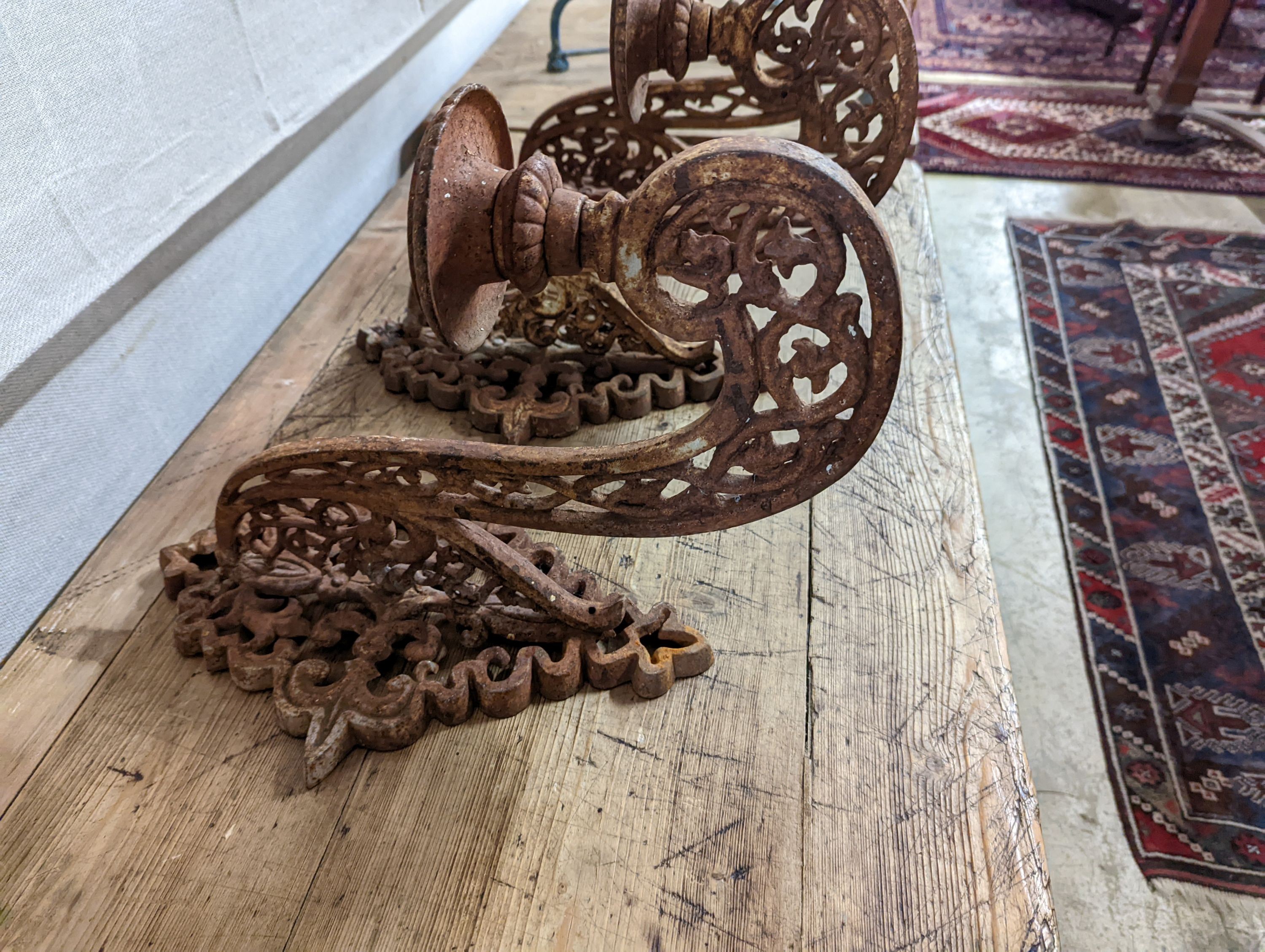 Three cast iron pricket wall sconces. W-28cm.